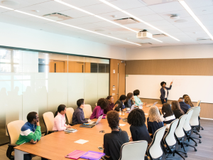 A group of people seated around a conference table